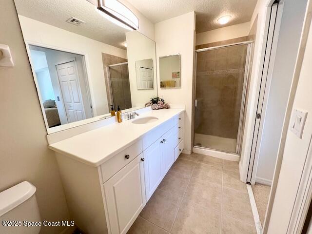 6828 Toland Drive, Unit 205 Melbourne, FL 32940 - Photo 20 of 26 a bathroom with a sink a toilet and a mirror
