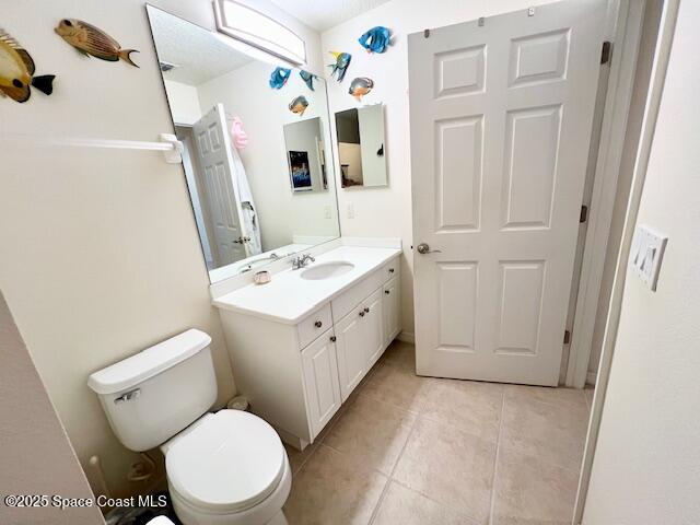 6828 Toland Drive, Unit 205 Melbourne, FL 32940 - Photo 23 of 26 a white toilet sitting next to a bathroom sink