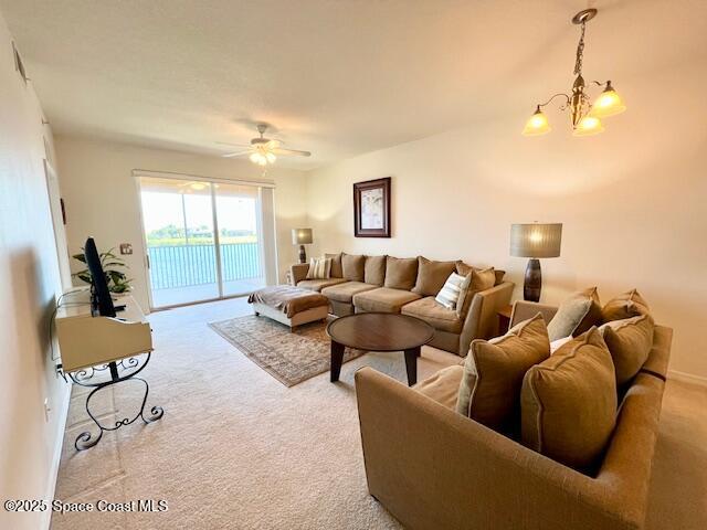 6828 Toland Drive, Unit 205 Melbourne, FL 32940 - Photo 9 of 26 a living room with furniture and a large window