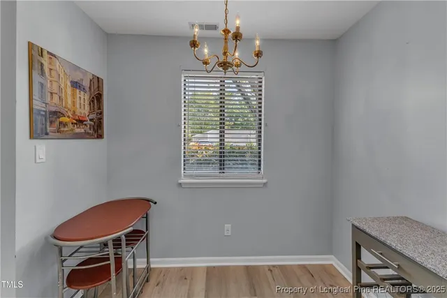 a room with a window and a chair