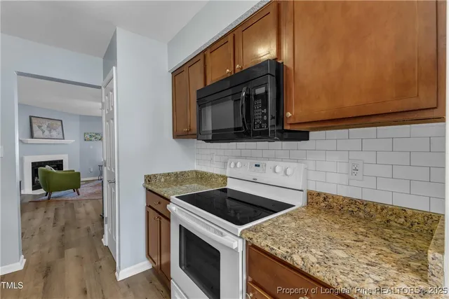 a kitchen with a stove and a microwave