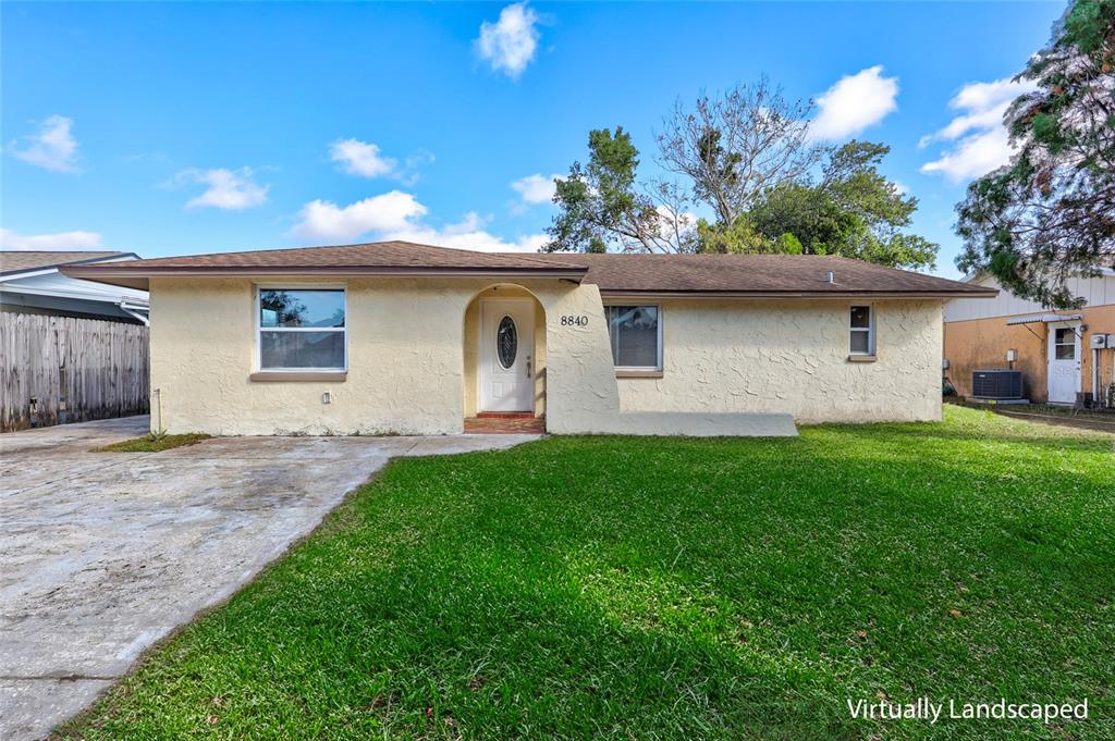 8840 Cairo Lane Port Richey, FL 34668 - Photo 1 of 1 a front view of house with yard