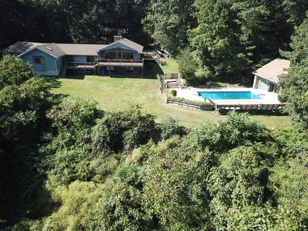 8 Birch Bluff Road Montgomery, MA 01085 - Photo 1 of 41 an aerial view of a house with swimming pool and garden