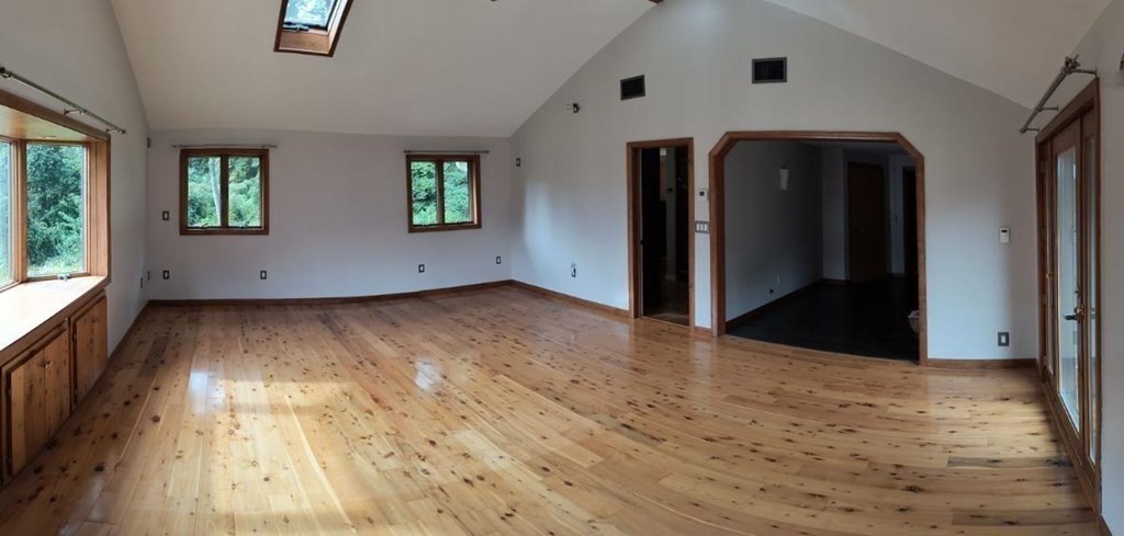 8 Birch Bluff Road Montgomery, MA 01085 - Photo 24 of 41 wooden floor in an empty room with a window