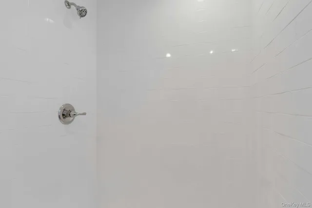 a bathroom with a sink toilet and window