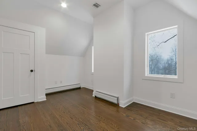 a view of a balcony with a small yard