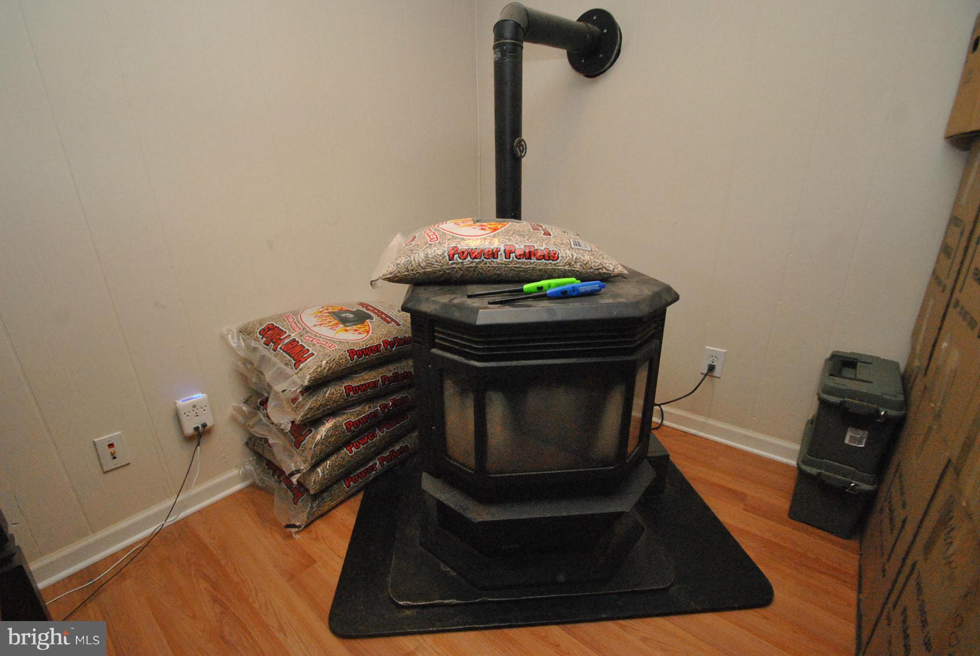 8128 Conduit Road Baltimore, MD 21234 - Photo 20 of 23 PELLET STOVE IN BASEMENT