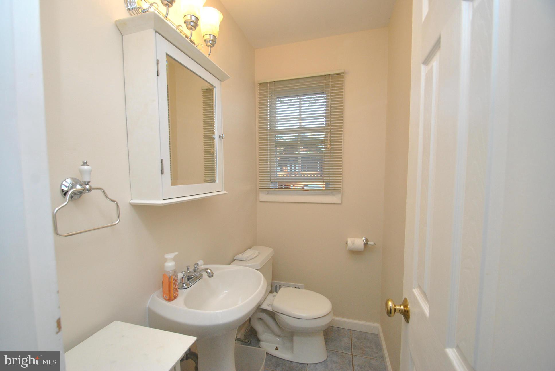 8128 Conduit Road Baltimore, MD 21234 - Photo 8 of 23 UPDATED 1/2 BATH ON MAIN LEVEL