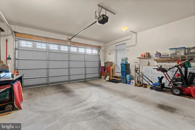 a view of a garage with rack and bicycle