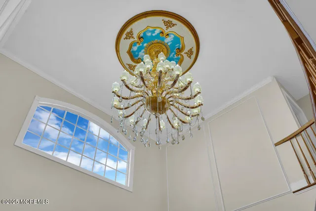 a kitchen with a sink a stove a refrigerator cabinets and a dining table