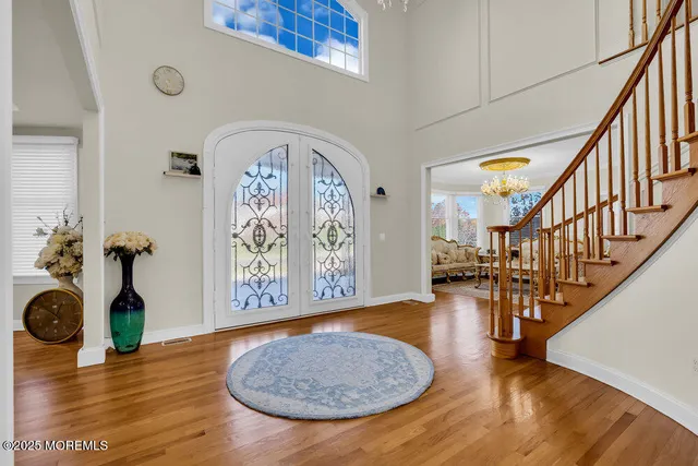 a kitchen with kitchen island granite countertop a sink stove and cabinets