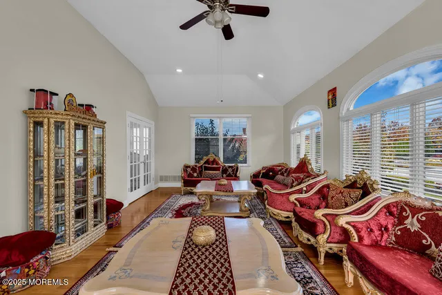 a view of a dining room with furniture and chandelier