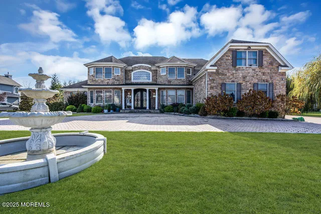 a pathway of a house with a yard