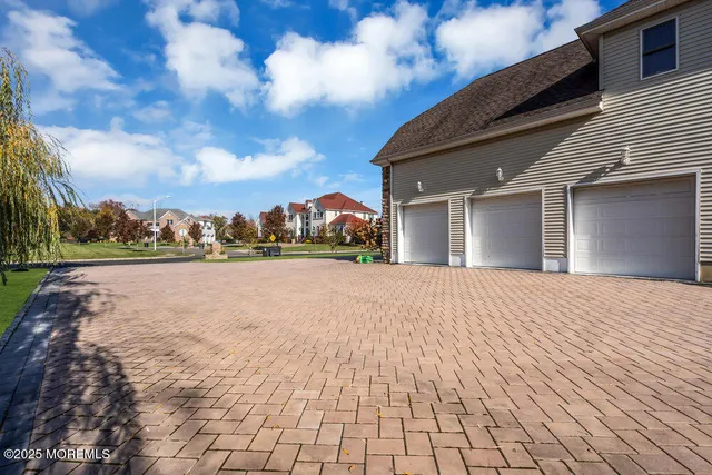 a living room with furniture a chandelier and a rug