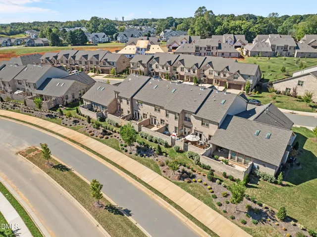 a outdoor living room with patio furniture and a fireplace