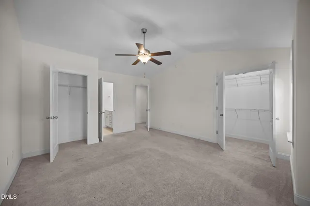 a kitchen with granite countertop cabinets stainless steel appliances a sink and a large window