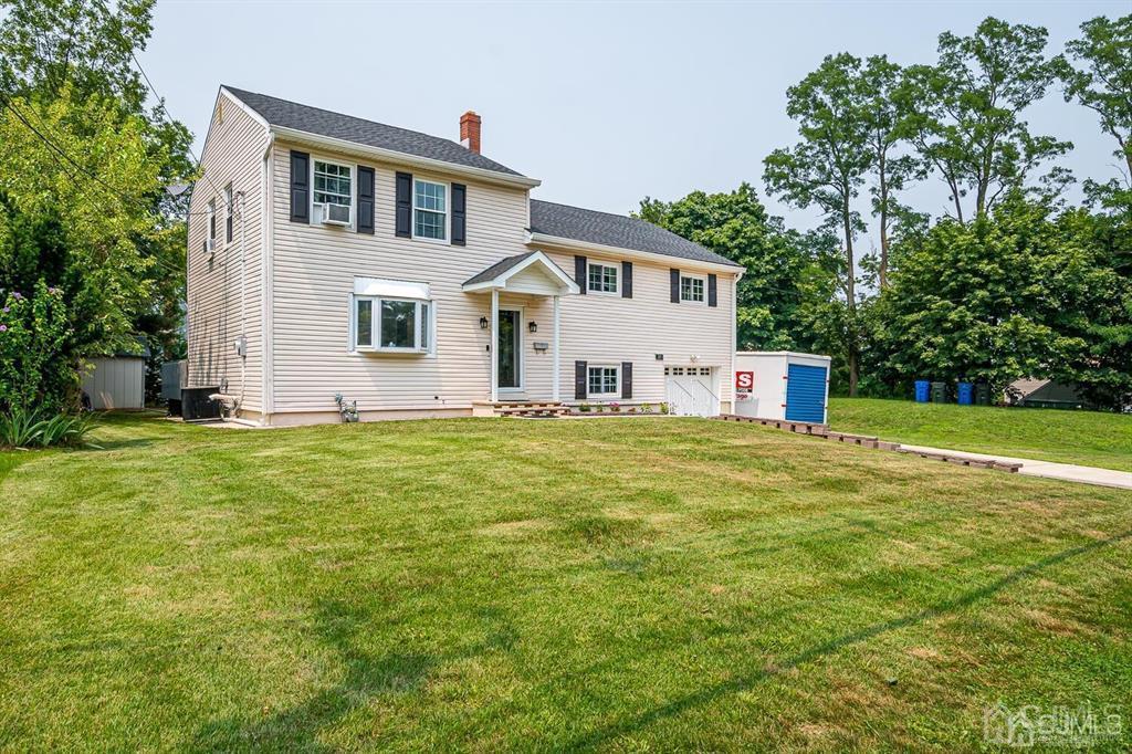 301 Colonia Boulevard Colonia, NJ 07067 - Photo 2 of 51 a front view of a house with a yard