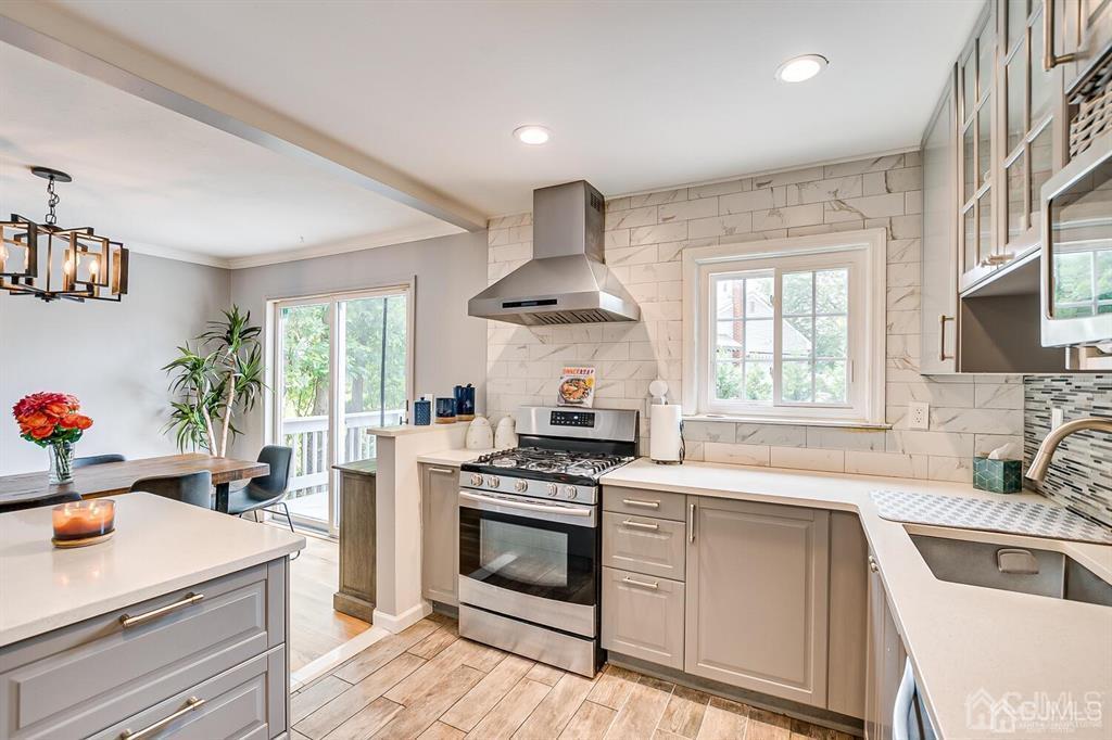 301 Colonia Boulevard Colonia, NJ 07067 - Photo 26 of 51 a kitchen with granite countertop a sink stainless steel appliances and cabinets