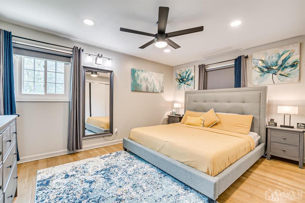 301 Colonia Boulevard Colonia, NJ 07067 - Photo 27 of 51 a bedroom with a large bed and a window