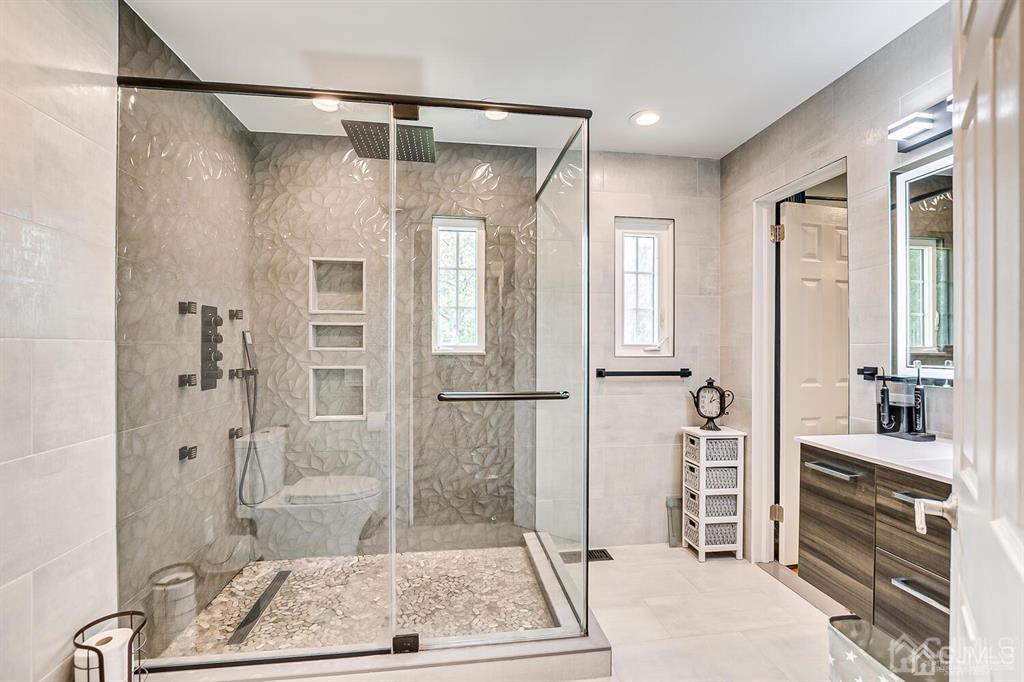 301 Colonia Boulevard Colonia, NJ 07067 - Photo 29 of 51 a bathroom with a tub shower and sink