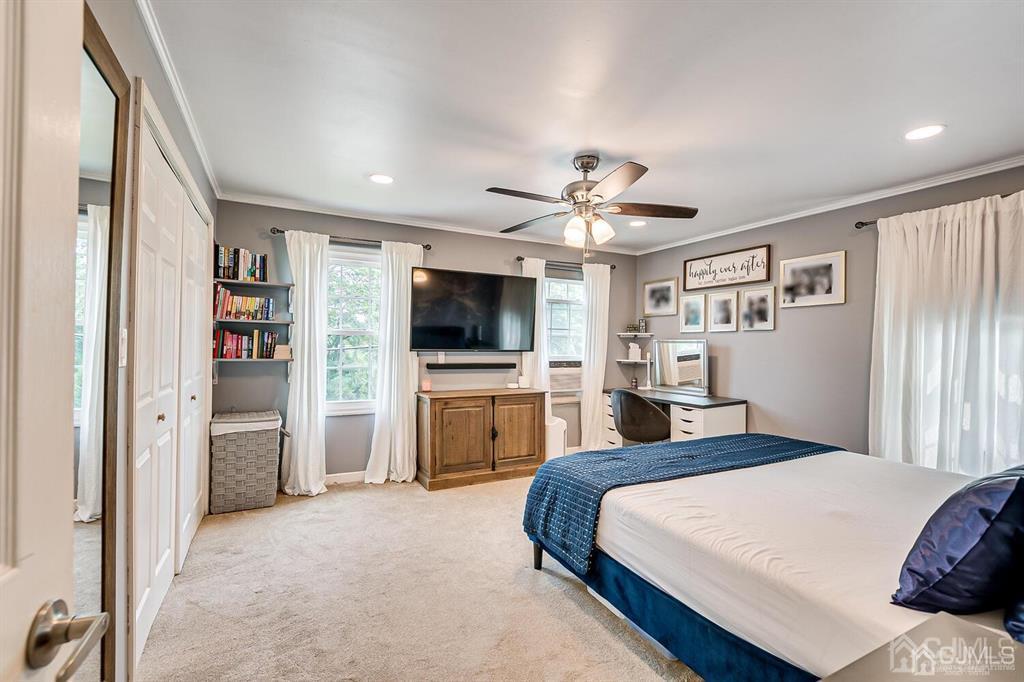 301 Colonia Boulevard Colonia, NJ 07067 - Photo 33 of 51 a bedroom with a bed and a flat screen tv