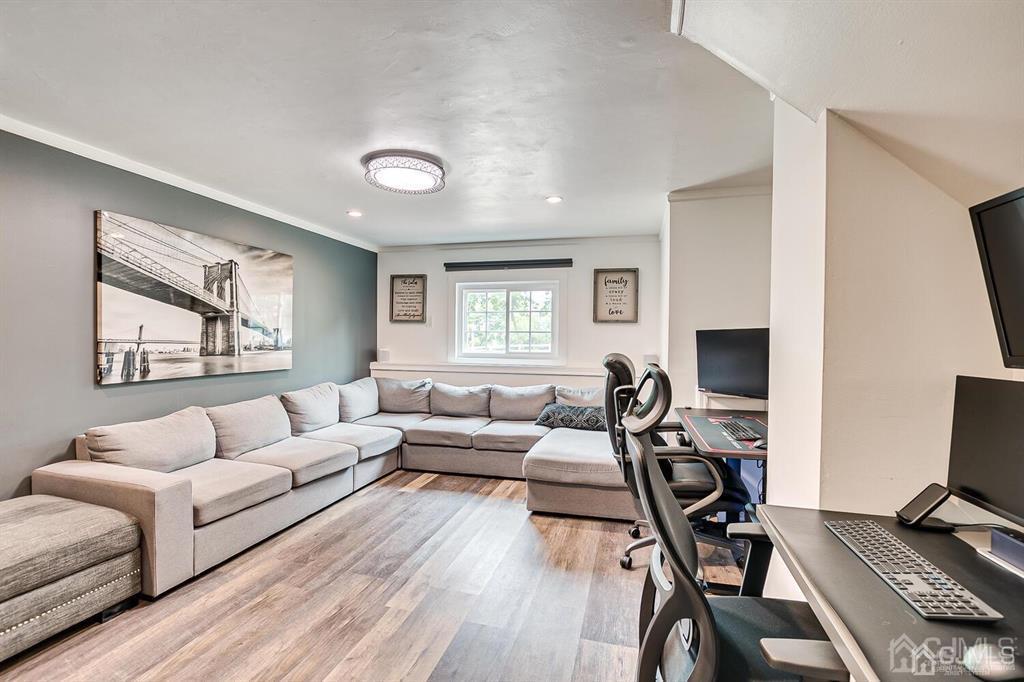 301 Colonia Boulevard Colonia, NJ 07067 - Photo 36 of 51 a living room with furniture and a wooden floor