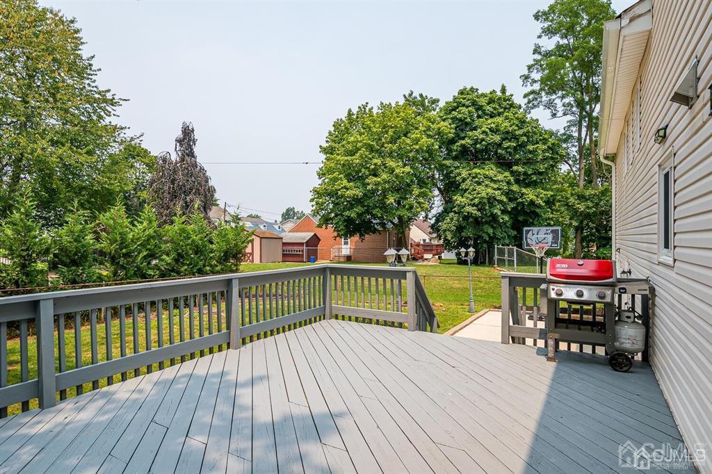 301 Colonia Boulevard Colonia, NJ 07067 - Photo 44 of 51 a view of house with deck and wooden floor