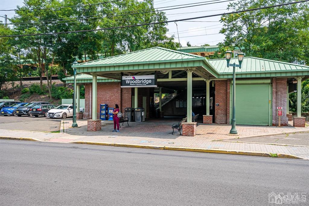 301 Colonia Boulevard Colonia, NJ 07067 - Photo 50 of 51 a view of a cafe with a table and chairs under an umbrella