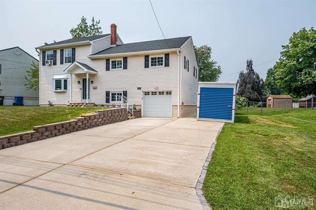 301 Colonia Boulevard Colonia, NJ 07067 - Photo 9 of 51 a front view of house with yard