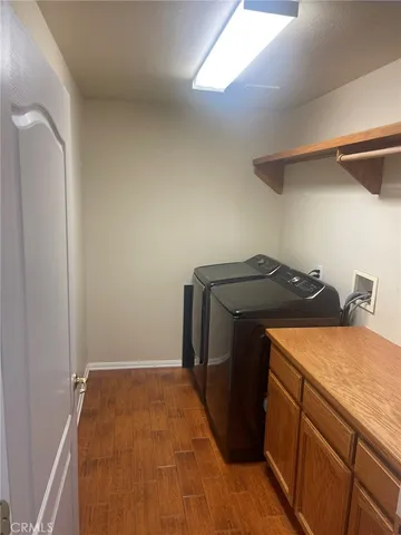 a living room with stainless steel appliances kitchen island granite countertop furniture and a dining table