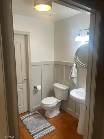 a kitchen with stainless steel appliances kitchen island granite countertop a refrigerator a stove top oven a sink and dishwasher