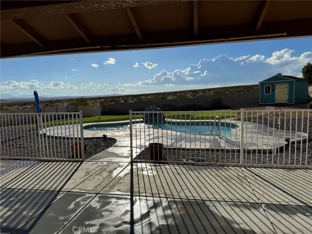 a view of a backyard of the house