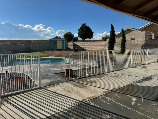 a backyard of a house with lots of green space and garden view