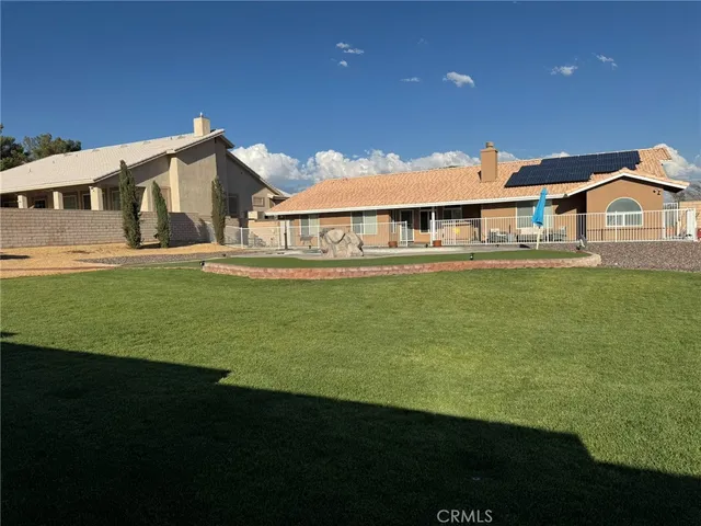 a white toilet sitting next to a bathroom sink and vanity