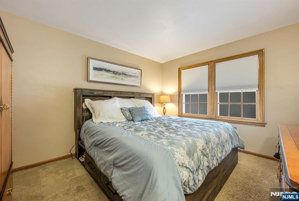 431 Goffle Road Wyckoff, NJ 07481 - Photo 9 of 19 a bedroom with a bed and a window