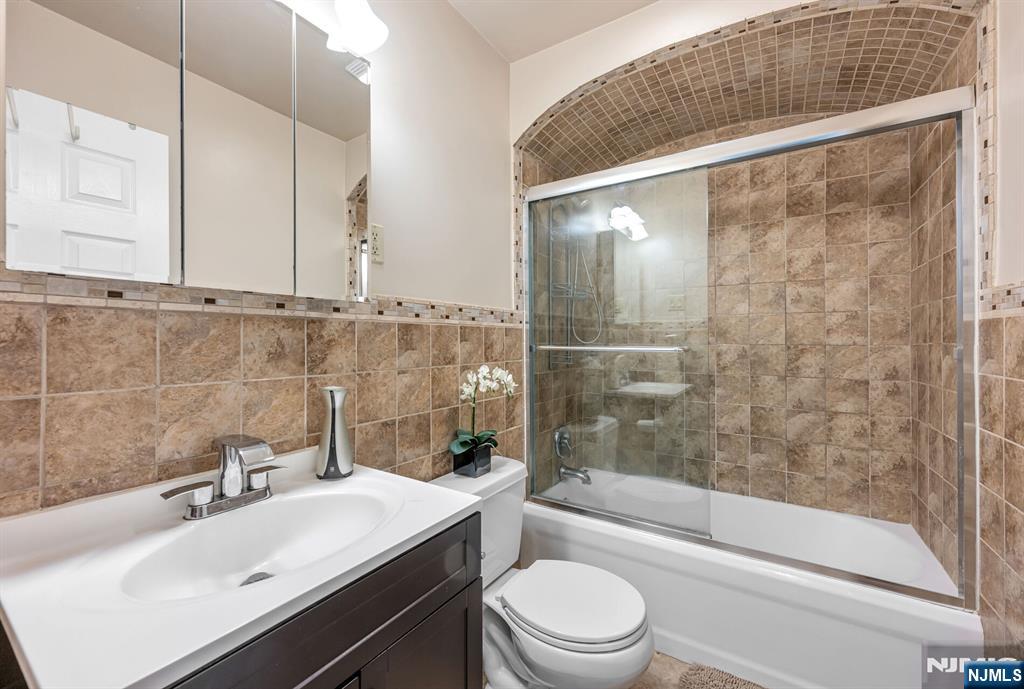 431 Goffle Road Wyckoff, NJ 07481 - Photo 10 of 19 a bathroom with a sink toilet and shower