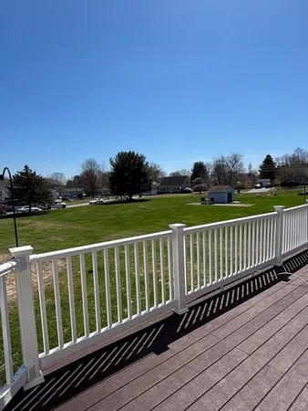 a view of deck with a wooden fence