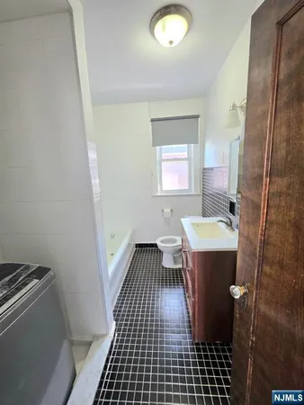 a view of a bathroom with sink and mirror