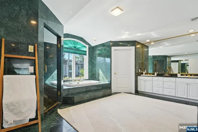 a large white kitchen with a large window