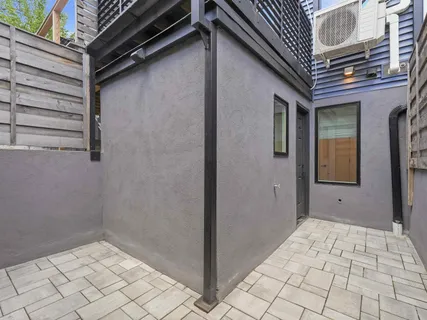 a view of a building with stairs and a floor to ceiling window