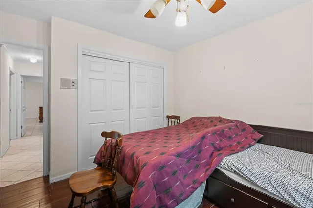 a kitchen with a dining table chairs and a refrigerator