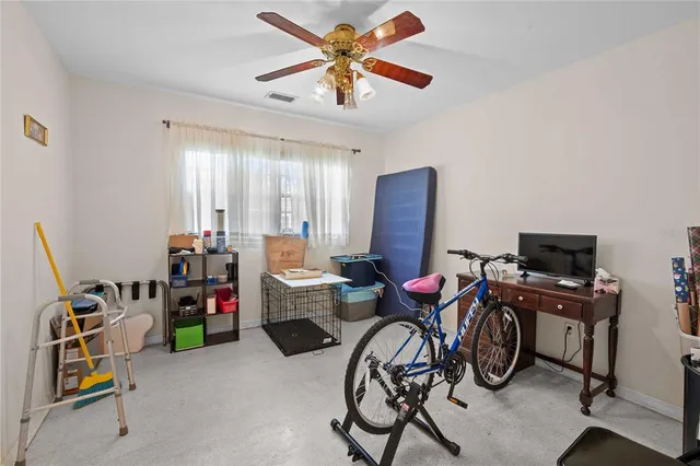 a bedroom with furniture and a window