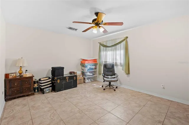 a room with a chandelier and a dresser