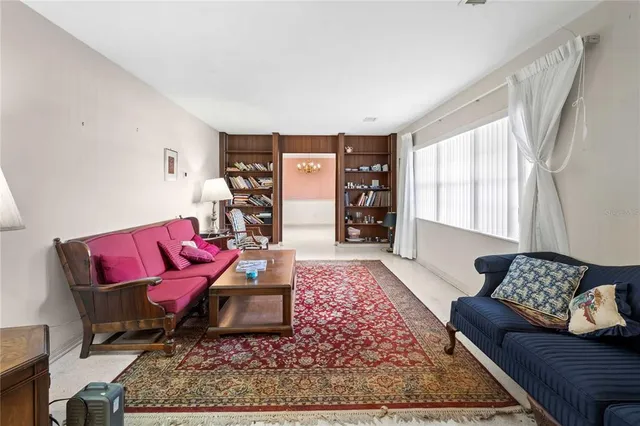 a living room with furniture and a rug