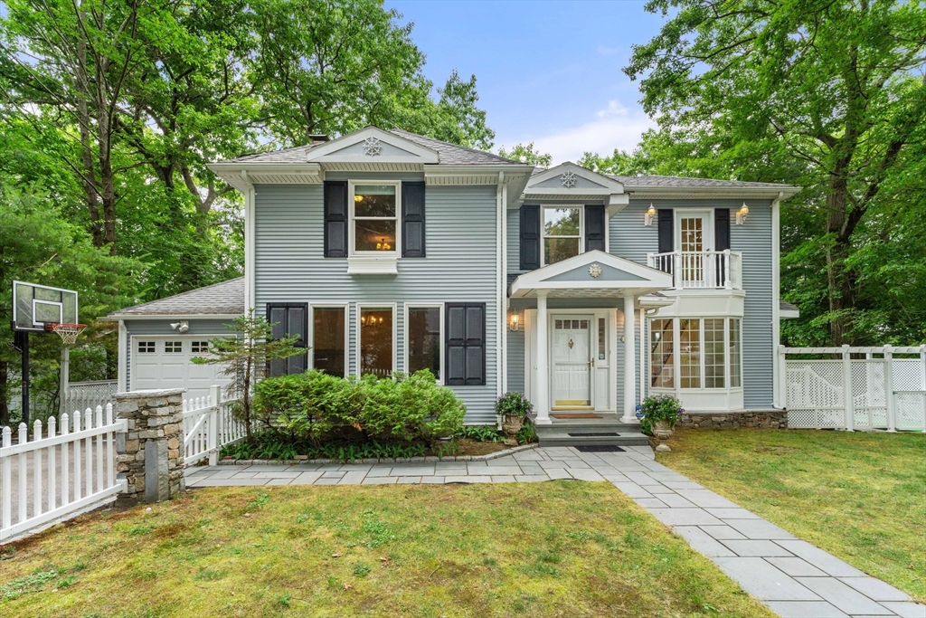 20 Morses Pond Road Natick, MA 01760 - Photo 1 of 15 a front view of a house with a yard