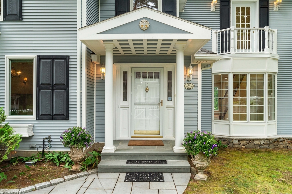 20 Morses Pond Road Natick, MA 01760 - Photo 2 of 15 a front view of a house with a yard