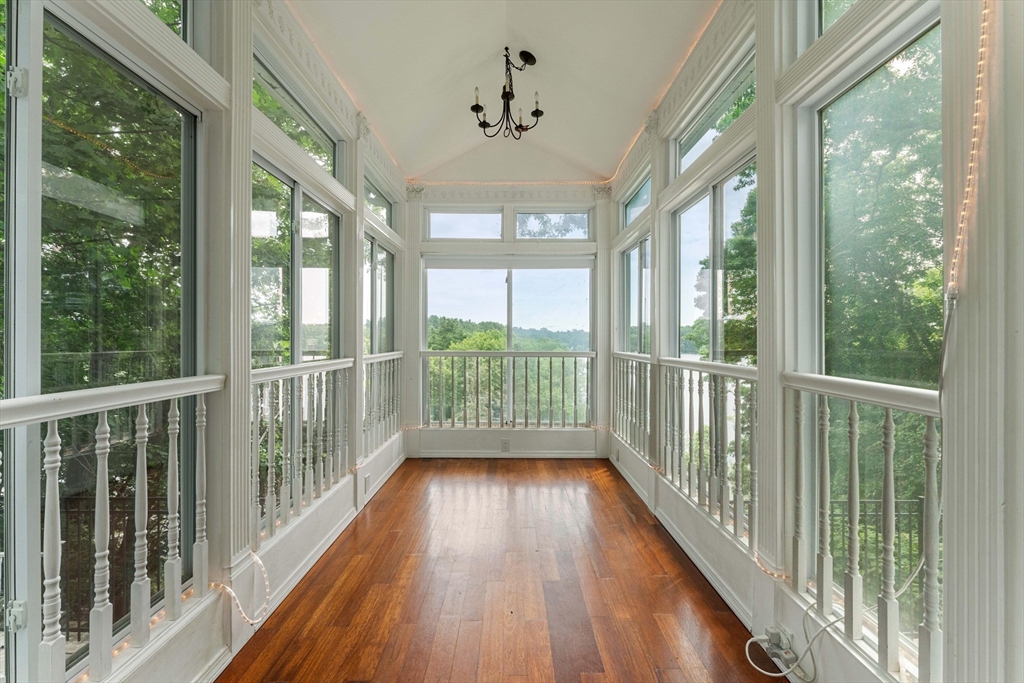 20 Morses Pond Road Natick, MA 01760 - Photo 6 of 15 a view of a balcony with wooden floor