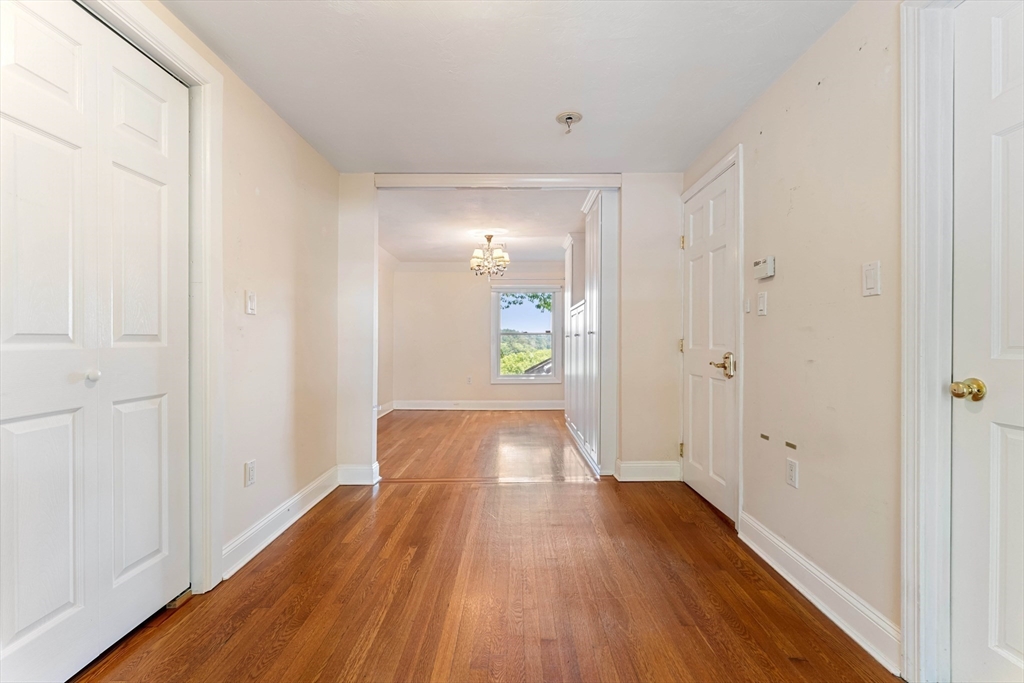 20 Morses Pond Road Natick, MA 01760 - Photo 7 of 15 a view of a hallway with wooden floor
