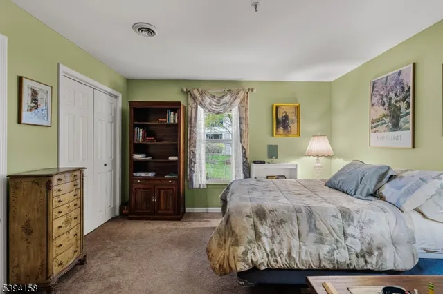 a bathroom with a double vanity sink mirror and toilet
