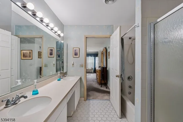 a bathroom with a toilet a sink and a mirror